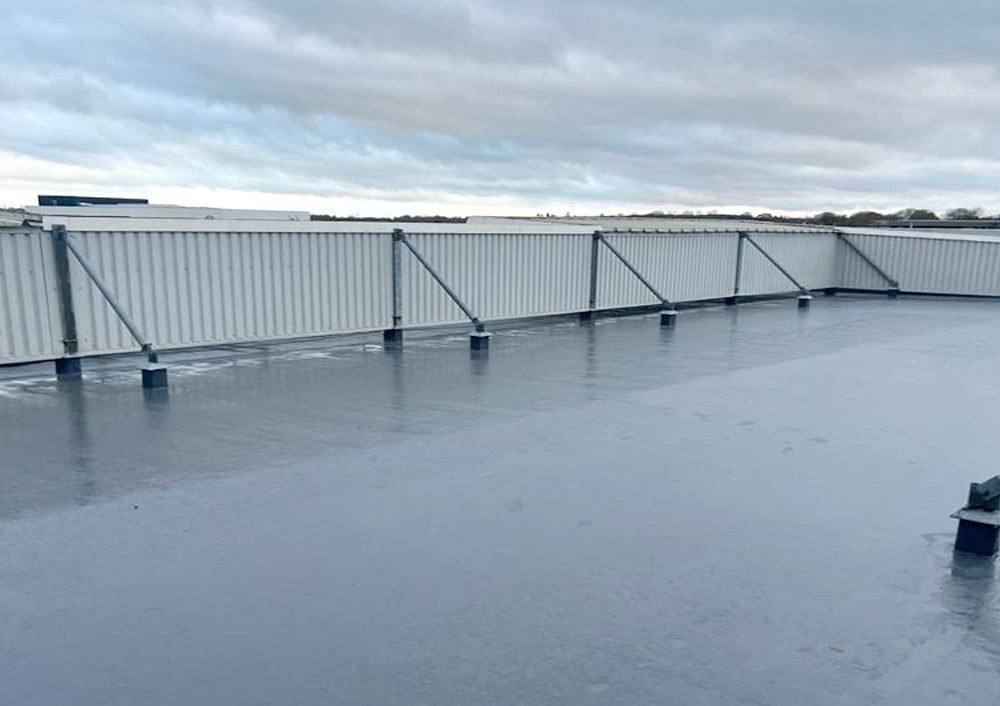 Completed grey membrane roof with edge protection and plant, One Central Boulevard, Solihull