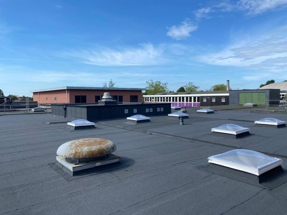 New built-up bituminous roof with replacement rooflights, Thomas Wolsey School, Ipswich