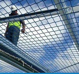 Safety netting rigged beneath a roof by Absolute Netting before the works start